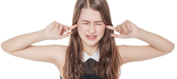 Woman plugging ears