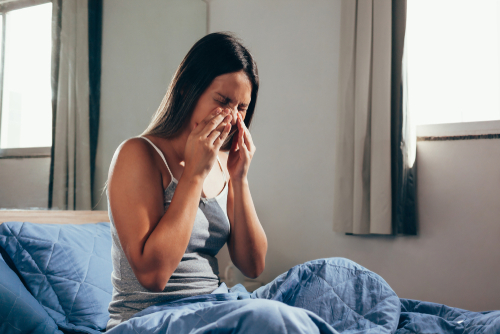 Woman suffering from a cold