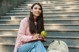 woman holding apple