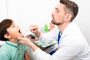 Doctor examining a young patient