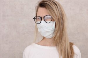 Woman wearing a mask with eyeglasses