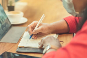 woman writing in notebook