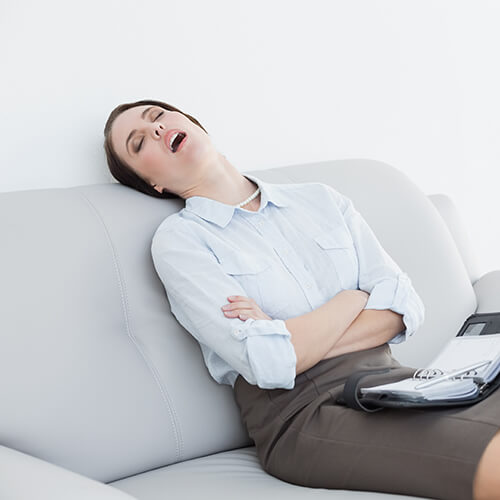 Woman Asleep On Couch